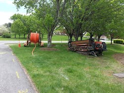 Horizontal boring of fiber conduit. Horizontal boring of fiber conduit.