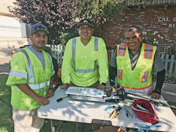 An experienced mentor helps teach complex tasks like fusion splicing cables. An experienced mentor helps teach complex tasks like fusion splicing cables.