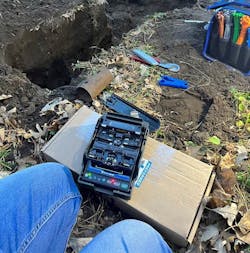 Work in the field includes performing fusion splices on a cut fiber at a residential home.