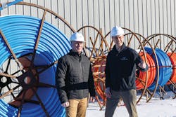 (left to right) Joe with Colin Lodl, OSP Project Engineering Manager, reviewing fiber supplies. (left to right) Joe with Colin Lodl, OSP Project Engineering Manager, reviewing fiber supplies.