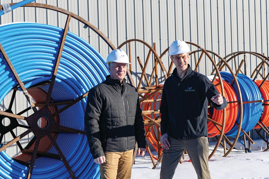 (left to right) Joe with Colin Lodl, OSP Project Engineering Manager, reviewing fiber supplies.
