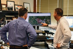 (left to right) Joe and Travis Radnor, Senior Director of OSP Engineering, strategizing over fiber maps. (left to right) Joe and Travis Radnor, Senior Director of OSP Engineering, strategizing over fiber maps.