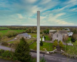 Figure 2. Pictured is a multi-band, tri-sector antenna deployed by Cellnex in the village of Vicarstown, County Laois, Ireland. (Photo source: Alpha Wireless) Figure 2. Pictured is a multi-band, tri-sector antenna deployed by Cellnex in the village of Vicarstown, County Laois, Ireland. (Photo source: Alpha Wireless)