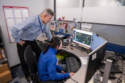 Amundson reviewing the fiber network design of the market construction that Leah Wisdorf, Manager of OSP Construction, oversees in Wisconsin. Amundson reviewing the fiber network design of the market construction that Leah Wisdorf, Manager of OSP Construction, oversees in Wisconsin.