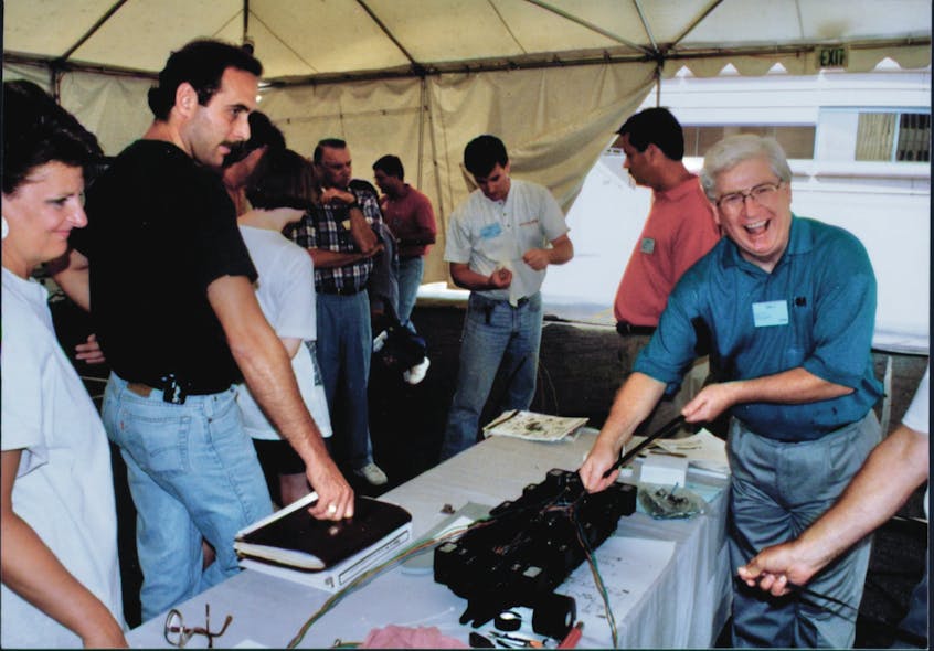 Figure 1. Dan Silver of 3M (right, at the Fiber U Conference in 1994), was one of the best trainers ever. He always enjoyed teaching others about 3M products. Dan was an advocate for training and certification and one of the founders of the FOA.