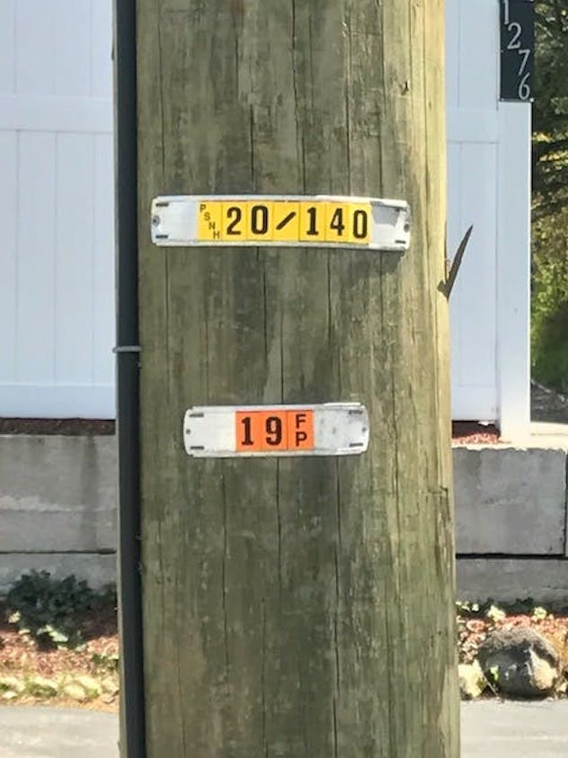 pole_tags__psnh_and_fp_on_utility_pole__great_pict