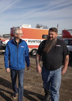 Wynschenk (left) and Greg Higdon (right), Hunter&apos;s Director of Installation and Maintenance, walk the yard at Hunter&apos;s Central Point, OR, location.