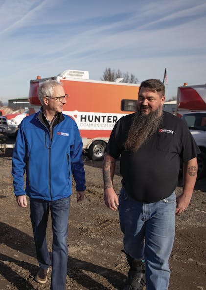 Wynschenk (left) and Greg Higdon (right), Hunter&apos;s Director of Installation and Maintenance, walk the yard at Hunter&apos;s Central Point, OR, location.