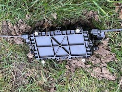 Successful fiber drop cable repair waiting to be buried. Successful fiber drop cable repair waiting to be buried.