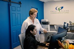 Brisa Ceja, Customer Response Representative, and Janelle review a customer order at the front desk in McCook, Nebraska. Brisa Ceja, Customer Response Representative, and Janelle review a customer order at the front desk in McCook, Nebraska.
