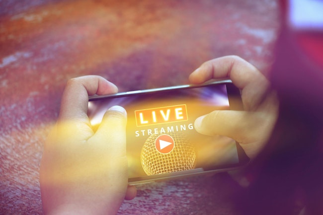 Two Hand Holding Smart Phone With Live Streaming Concert ,live Streaming Word And Microphone On Screen Mobile Phone, Music Online Concept