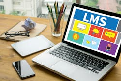 Learning Management System (LMS) Laptop on table. Warm tone Learning Management System (LMS) Laptop on table. Warm tone