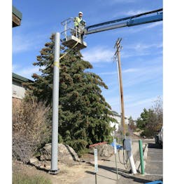 EasyStreet Systems team members installing a fiber composite pole in rural Bay County, Florida. EasyStreet Systems team members installing a fiber composite pole in rural Bay County, Florida.