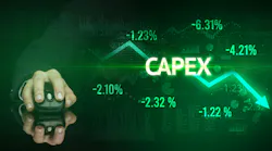 Male hand holding wireless peripheral with CAPEX inscription, modern business concept