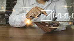 A person taking a survey on a tablet. A person taking a survey on a tablet.