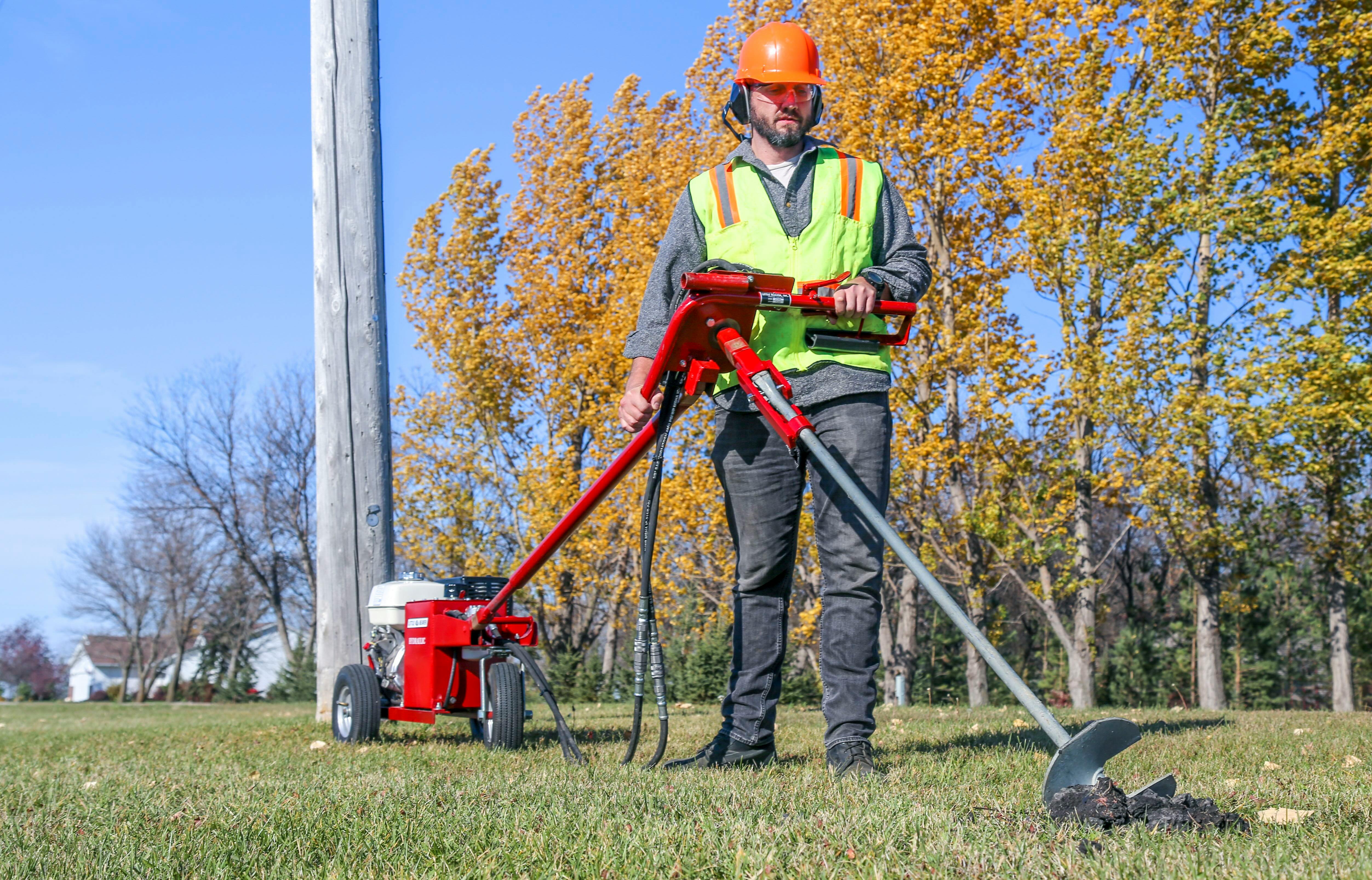 A hydraulic earth drill with a high-torque anchor handle and utility anchor adapter can significantly improve safety for anchor installation.